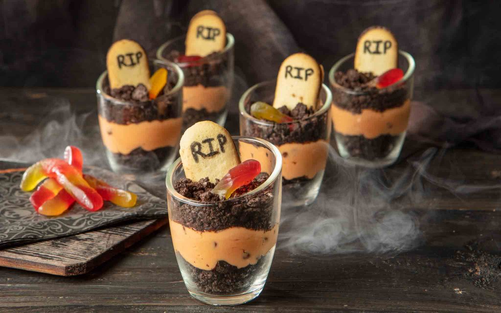 orange and black halloween graveyard dirt cake cheesecake trifles