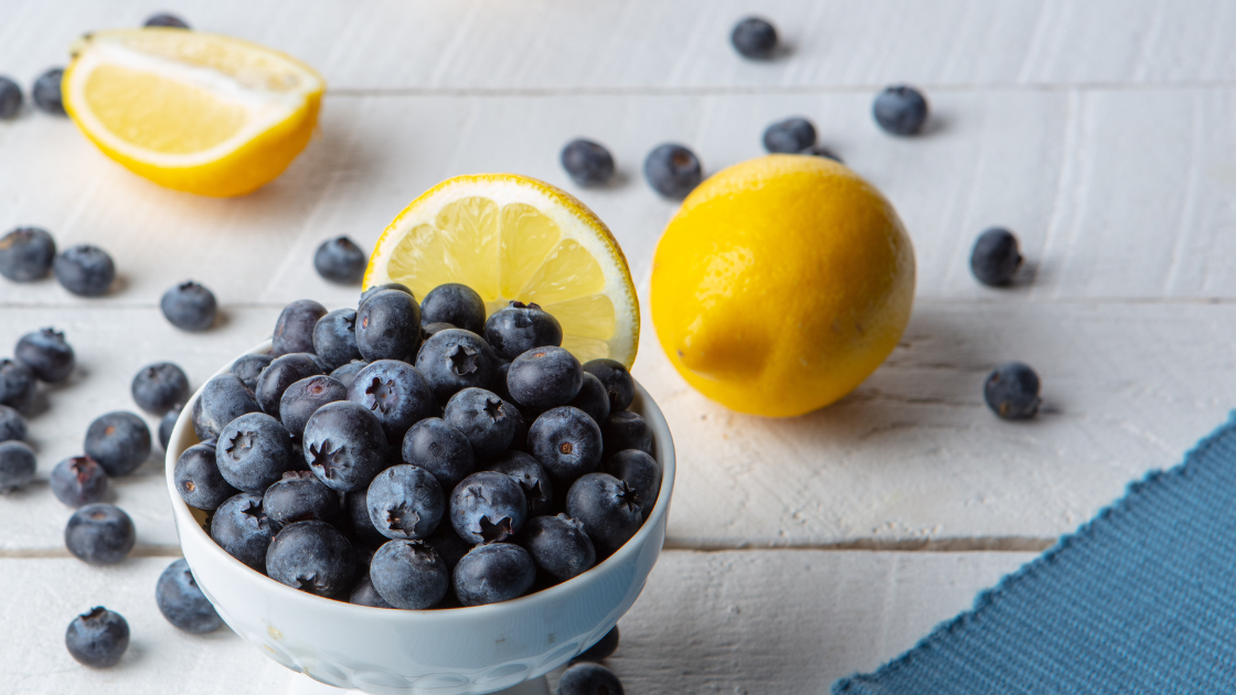 fresh Lemons and blueberries on a farmhouse background